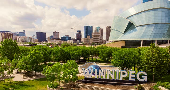 Winnipeg in summer with vibrant festivals and outdoor activities along rivers and parks